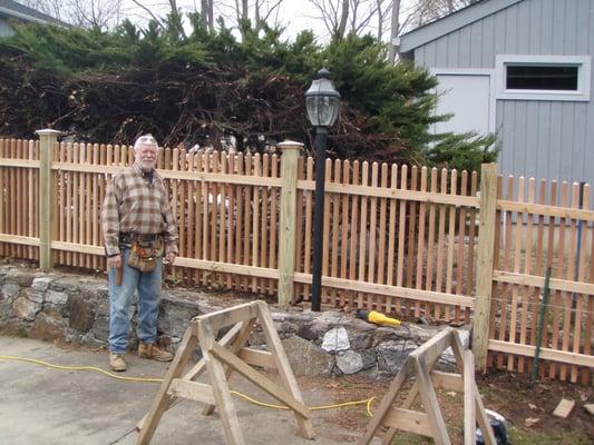 Bill Marshall owner of Colonial Fence Co. in Fairfield, installing our new fence. He installs all fences personally.