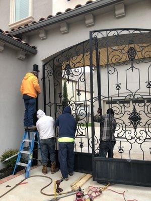 Replacing old rusted barrell hinges on an iron swing gate.