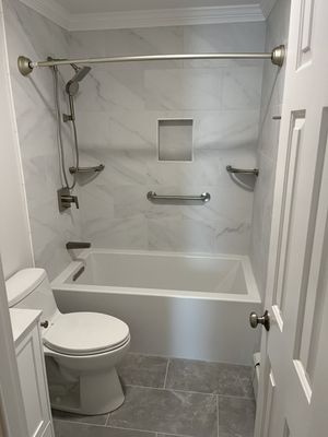 We remodeled this customer's bathroom with a Kohler tub and fixtures as well as custom floor and wall tile with a recessed shower niche.