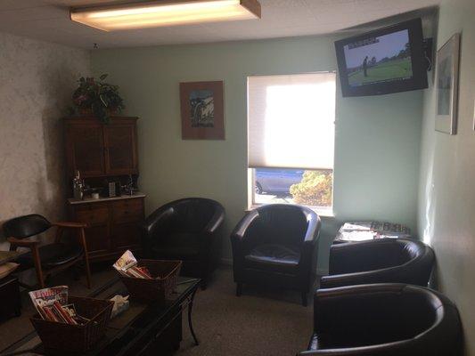 Comfortable seating and TV at Dr. John's office.