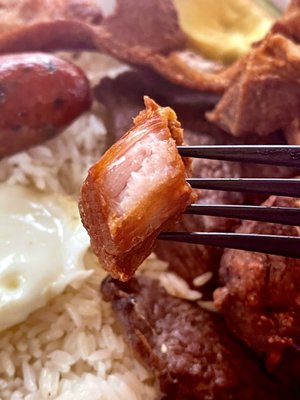 Piece of Chicharron de cerdo in Bandeja Paisa