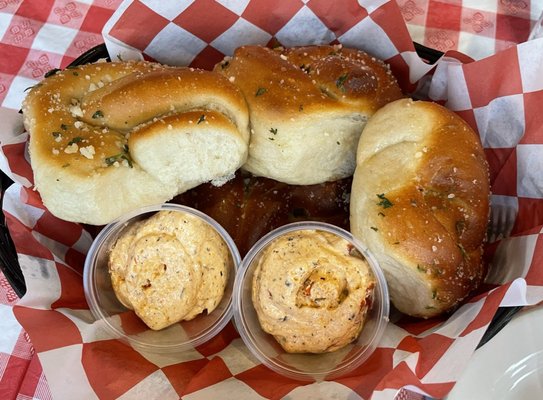 Bread basket with seasoned butter.