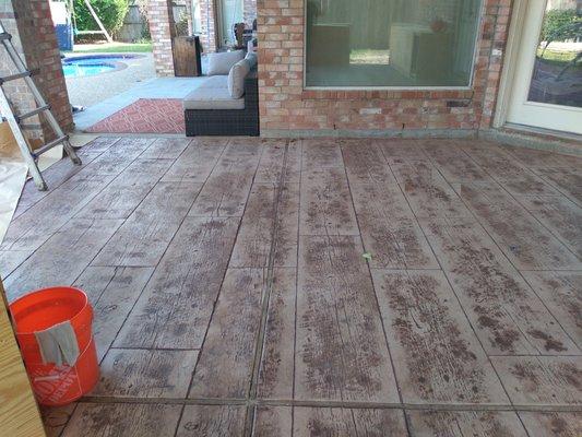 Stamped concrete floor adds a perfect finish to a beautiful outdoor kitchen.9