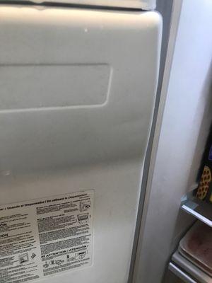 Dent inside freezer(they had to remove the refrigerator doors to push out the front door)