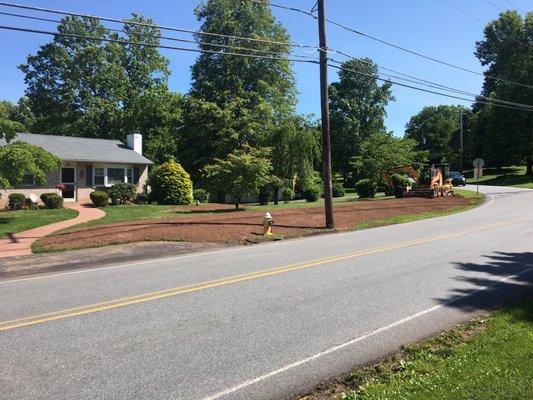 create berm in front yard to control water runoff from street