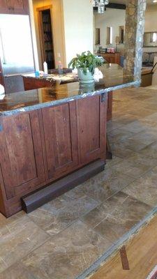 Kitchen & floor with weathering steel register cover.