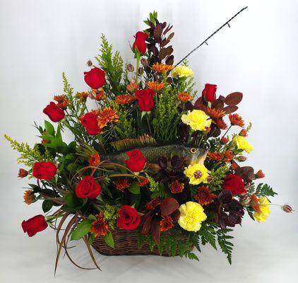 Fisherman Funeral Basket Arrangement with red, orange, and yellow flowers.