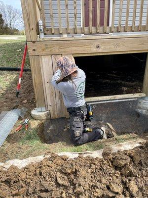 Dig proofing a deck takes serious work. But when done right, nothing will be digging under there again!