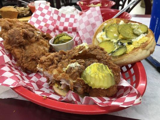 one breaded pork tenderloin cut into two big sandwiches