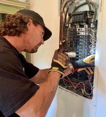 Licensed Professional Home Inspector, Wesley Smith, inspecting a home's electrical panel.