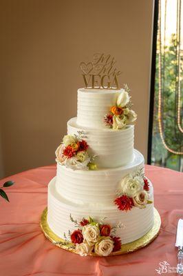 Almond wedding cake with strawberry mousse filling and buttercream