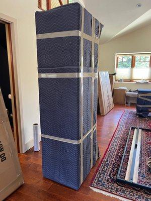 We wrap the furniture in moving blankets and then wrap them in heavy-duty shrink film to ensure they don't get damaged during transportation