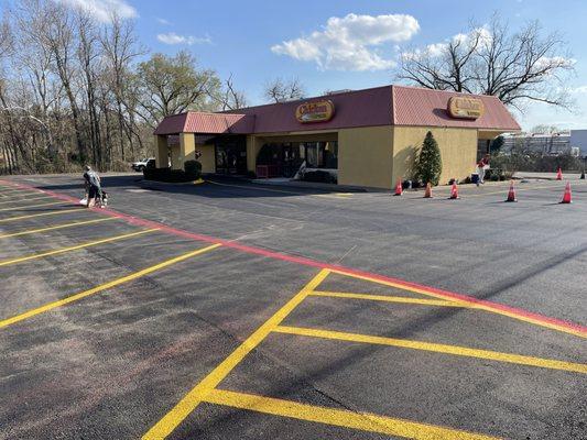 Asphalt and striped lot.