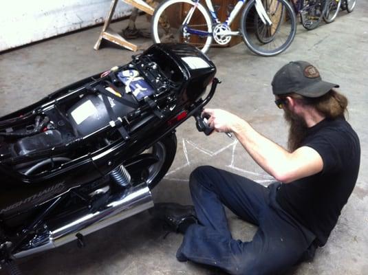 Josh working on the motorcycle