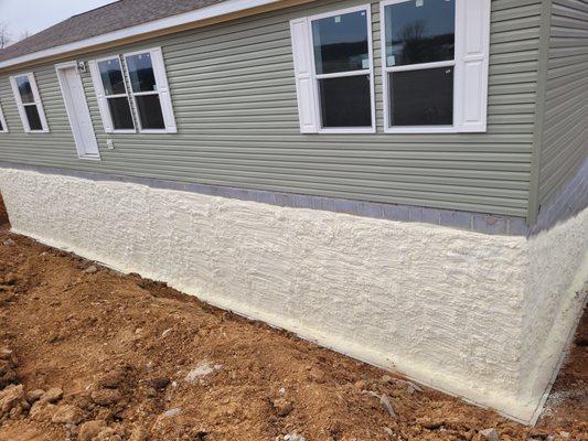 Poly spray foam on exterior foundation