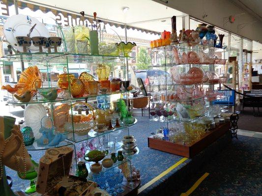 A large selection of collector glass greets you as you enter the store.