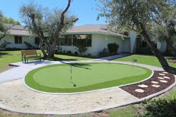 Our beautiful putting green has different terrains to better prepare our residents for everyday life when they go home.