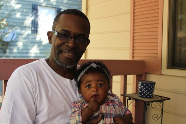 James Foster and his adorable granddaughter, who CNE helped save from foreclosure.