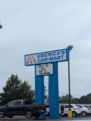 The sign says Sales Tax Paid, but the new manager won't pay mine even though I was told it would be paid when I bought the car 3 weeks ago!