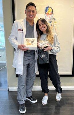 Dr Rosales receiving more sweet treats from an excited Invisalign patient.