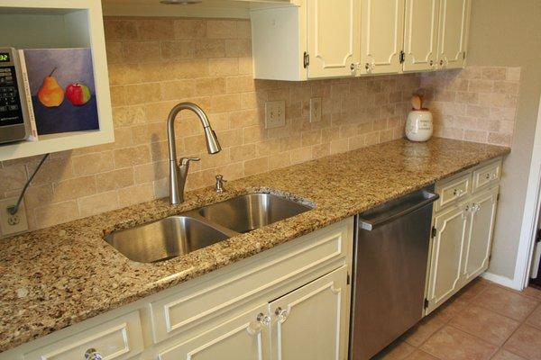 Napolean kitchen countertop with 4"x6" travertine tile backsplash