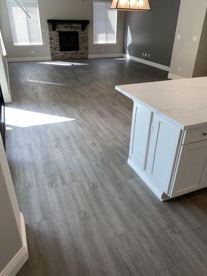 Luxury vinyl planks + Baseboards