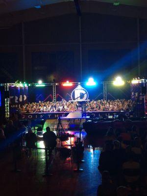 Award time. All the teams were seated, but the entire stage was covered.