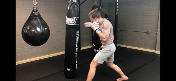 Muay Thai class heavy bag drills