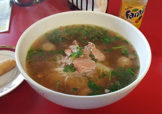 Gigantic bowl of noodle soup with pork, meatballs, and shrimp.