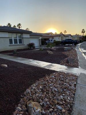 Layered 3-4" Cinnabar crushed rock on the edge of the property. Installed (5) 1'x1.5' Boulders. (2) 1.5'x3' Boulders. 1/2" Southwest brown