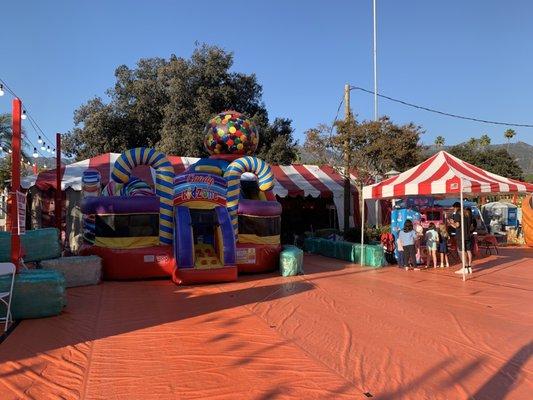 Bounce house and cotton candy machine.