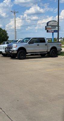 Lifted truck, MBRP side exit exhaust, ford V8 5.0 coyote engine.