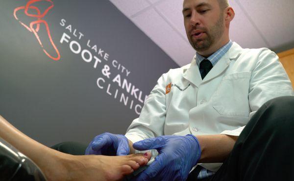 Dr. Christiaan Goebel, DPM, podiatrist, with patient.