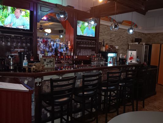 The fully stocked bar is a great place to grab a drink after work and catch a game or have a conversation with locals.