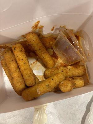 Sauce spilled maybe in driver's car?? Leaked onto pizza boxes, not to mention soggy sticks ugh