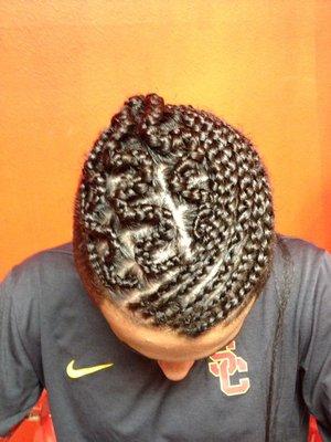 This Football player wanted quick braids with a special touch.