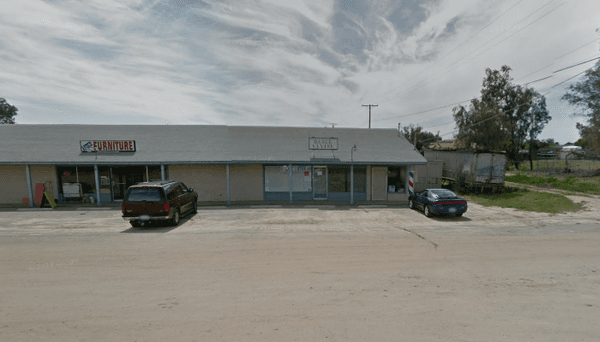 Ramona Barber Shop- all the way to the end of the building.