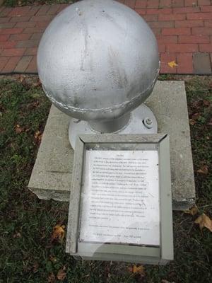 one item on the grounds of the museum about the ball on top of barns