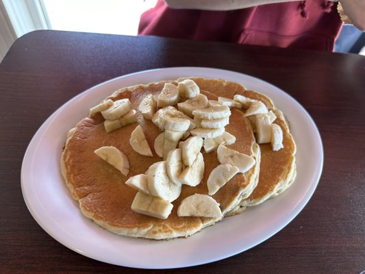 Pancakes with Chocolate chips inside and bananas on top