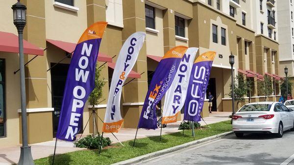 Feather Flags in front of our store at Brownsville Metro Rail Station