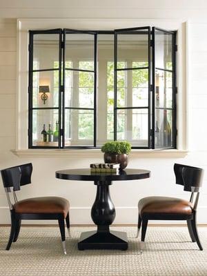 Another great table from Caracole called Mod-Urn. This table features a black caviar top and measures 39" round by 31" tall.