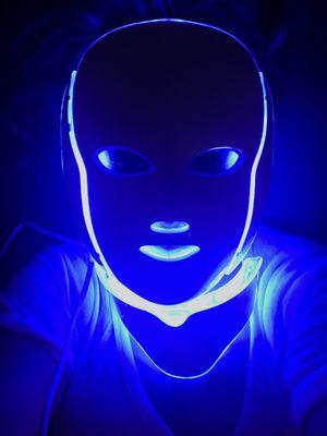 The mask goes through a series of different LED light colors (red, blue, pink).