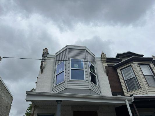 New siding new stucco new gutters and new Certainteed white granulated rubber roof system