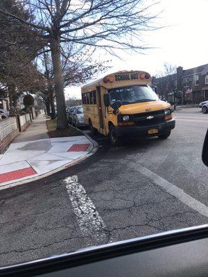 Bus #007 blocking crosswalk in residential neighborhood. 115th St & 135th Ave in Queens.  No school anywhere nearby.