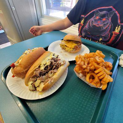 Curly fries, bacon cheese burger, and a Philly cheesesteak