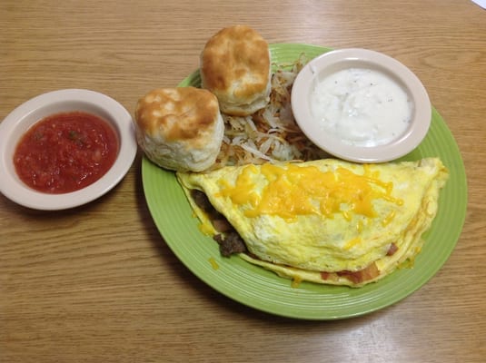 Wild Hog Omelet! Ham, Bacon, & Sausage hash browns biscuits and gravy.