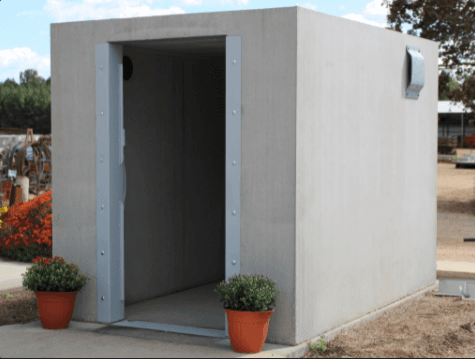 front door and entrance to a concrete shelter installed