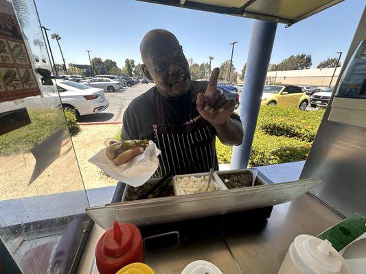 Owner prepping Hot Dog