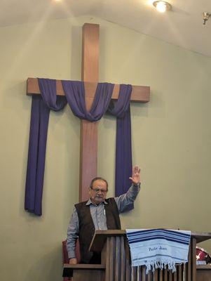 Pastor John in prayer before service.....