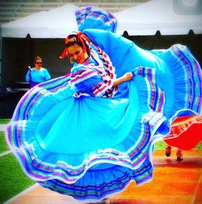 Our Director on the Mic and our Beautiful Folklorico #Dancer spinning on stage for the Annual #Relay for Life